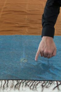 Russell Edwards, with a shawl found at the scene of Jack the Ripper's 4th murder. Pictured blood stains on the shawl from the murder of Catherine Eddowes 