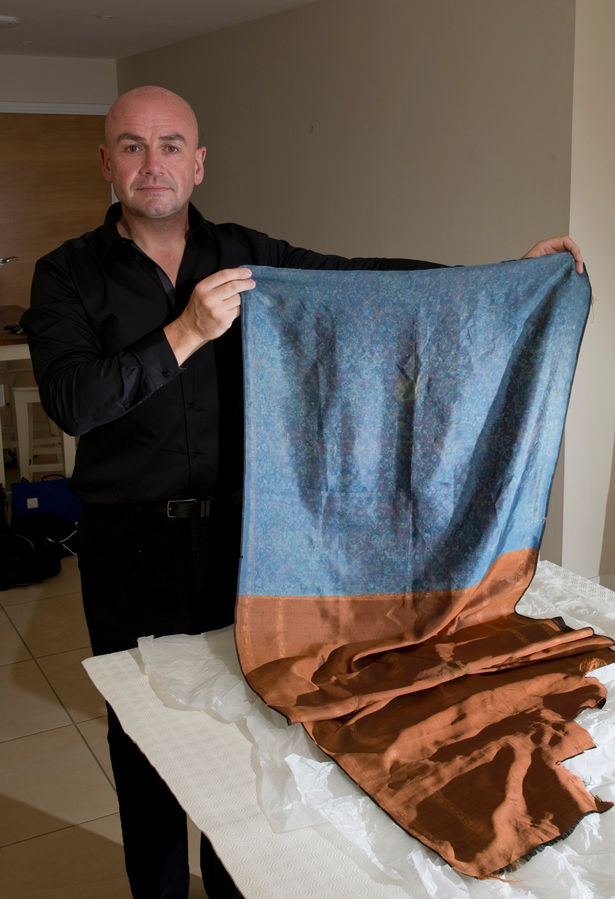 Russell Edwards, with a shawl found at the scene of Jack the Ripper's 4th murder. The garment was passed down from a policeman who kept it. Russell has used DNA testing on stains found on the shawl to identify the killer - a polish-born Aaron Kosminski http://www.mirror.co.uk/news/uk-news/jack-ripper-murder-mystery-how-4180390#ixzz3Eyp2D1Qp Follow us: @DailyMirror on Twitter | DailyMirror on Facebook